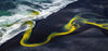 A large liquid wave of yellow and green color, entering in the sea, Meandering