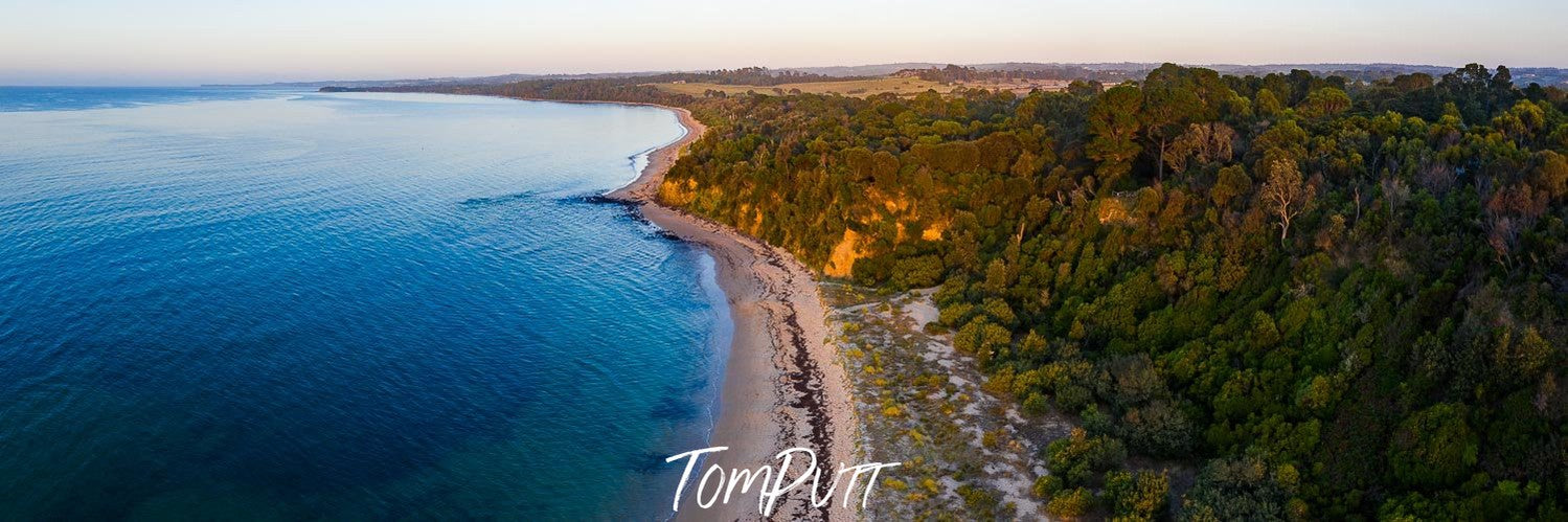 long green mountain wall with a seashore below, Merricks Beach - Mornington Peninsula VIC