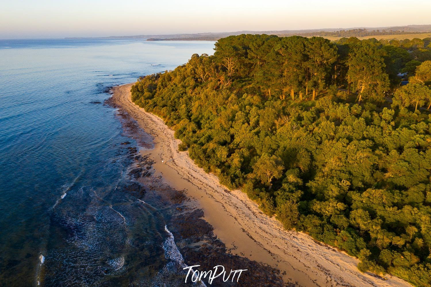 long green mountain wall with a seashore below, Merricks Beach from above - Mornington Peninsula VIC