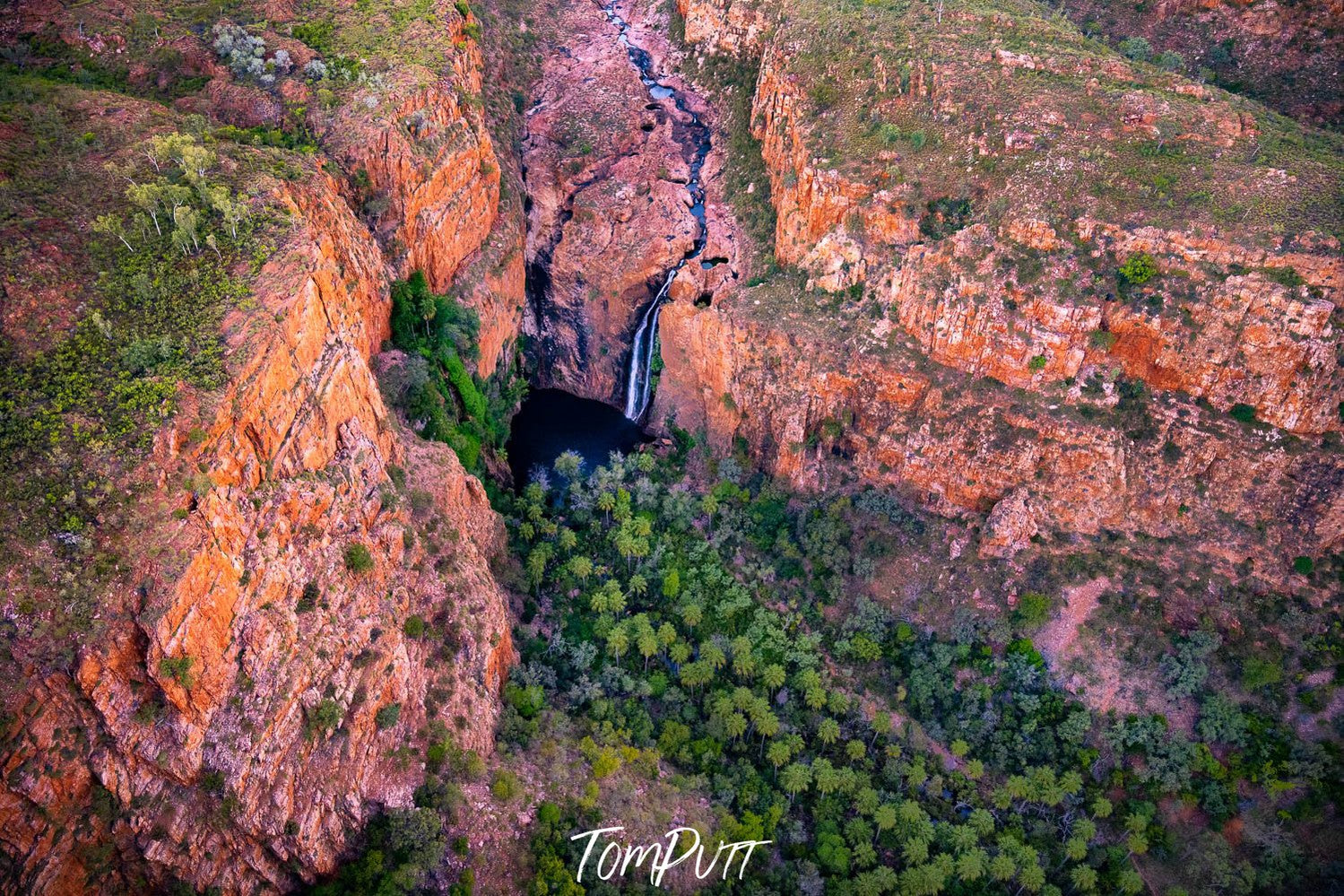 Aerial view of a creeky mountain with a tunnel and a lot of greenery outside, Miri Miri Falls, El Questro, The Kimberley