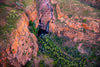 Aerial view of a creeky mountain with a tunnel and a lot of greenery outside, Miri Miri Falls, El Questro, The Kimberley