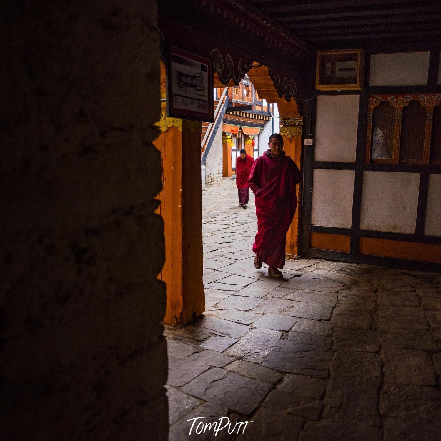 Walking monk in a temple, Monks, Bhutan