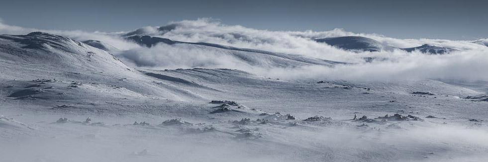 Long mountain walls fully covered with snow, Lunar Landscape - Snowy Mountains NSW
