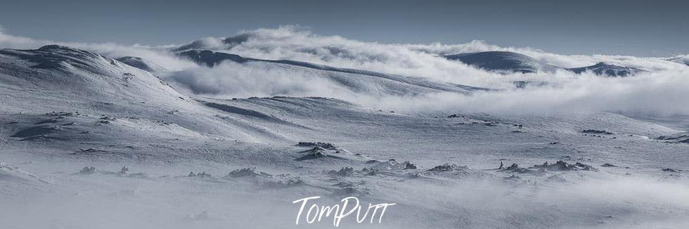 Long mountain walls fully covered with snow, Lunar Landscape - Snowy Mountains NSW