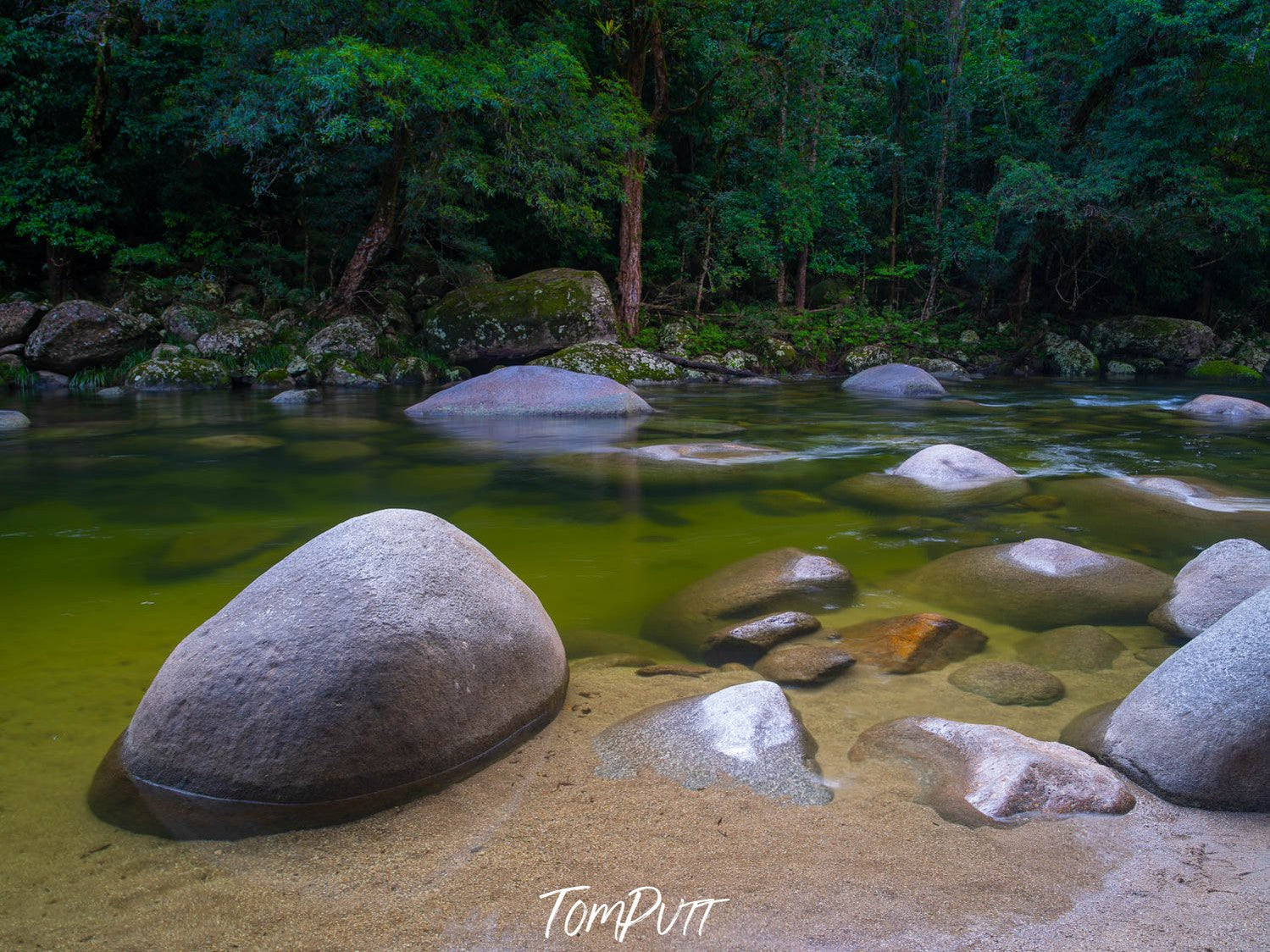 Lake with greenery around, and rounded stones over, Mossman Gorge Boulders, The Daintree - Queensland