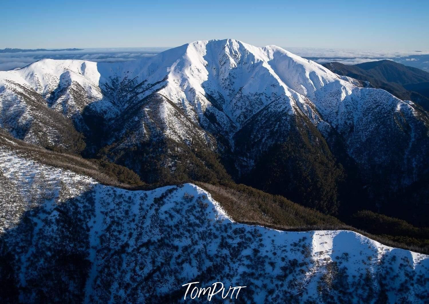 Beautiful giant mountains covered with snow from the top, and dense grass and bushes on the bottom and the ground, Feathertop Awakens - Victorian High Country