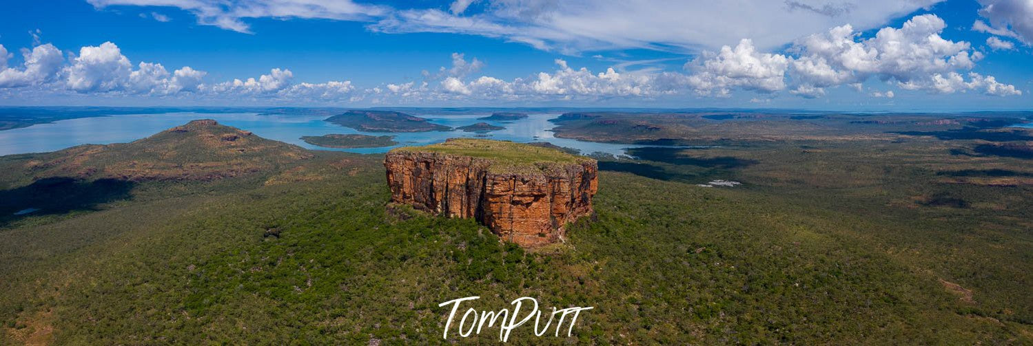 Aerial view of a standing stone between a wide greeny area, Mount Trafalgar Panorama, The Kimberley, Western Australia