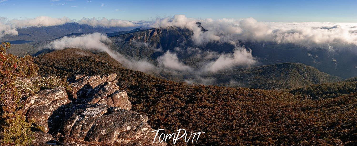 Aerial view of long mountain walls with their peaks over the clouds, Mt William - The Grampians, VIC