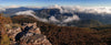Aerial view of long mountain walls with their peaks over the clouds, Mt William - The Grampians, VIC