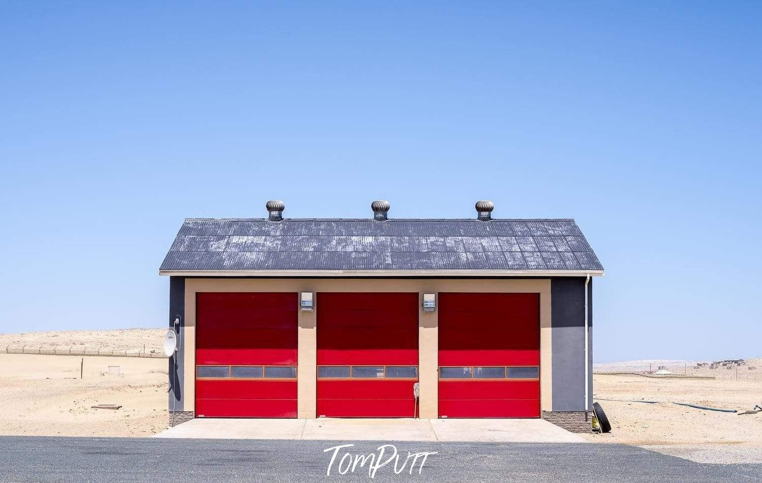 A small house with red walls and a black roof, in a desert area, Namibia #3