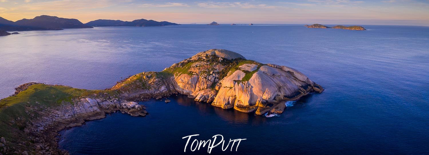 A giant rocky mountain island partially covered with greenery, Wilson's Promontory #38