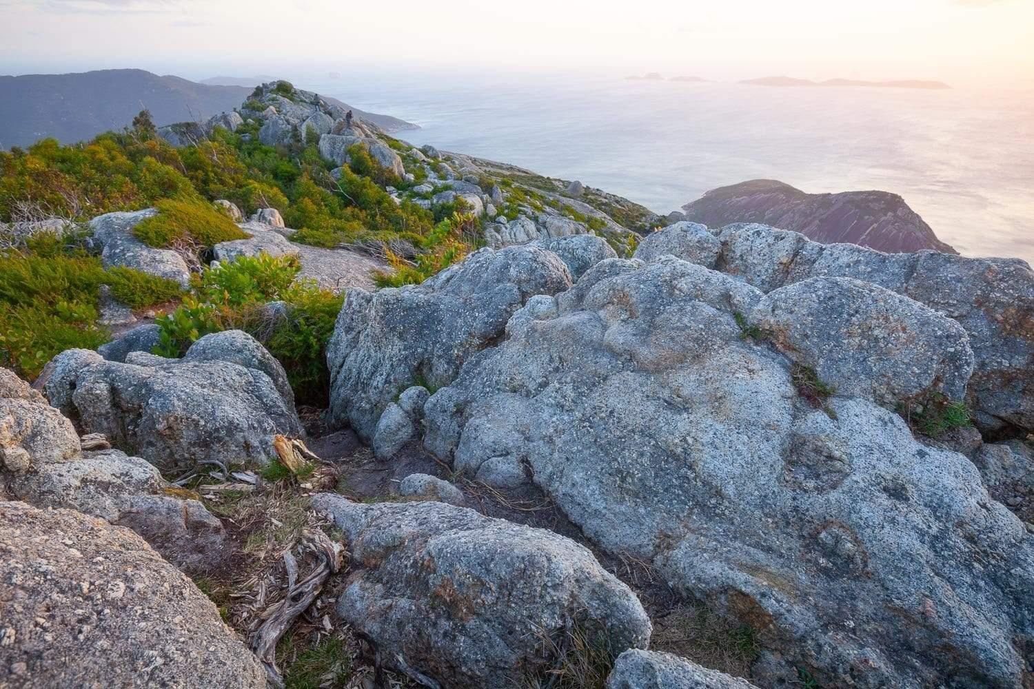 A hill area with mountain rocks and some greenery over, Oberon Sunset - Wilson's Promontory VIC