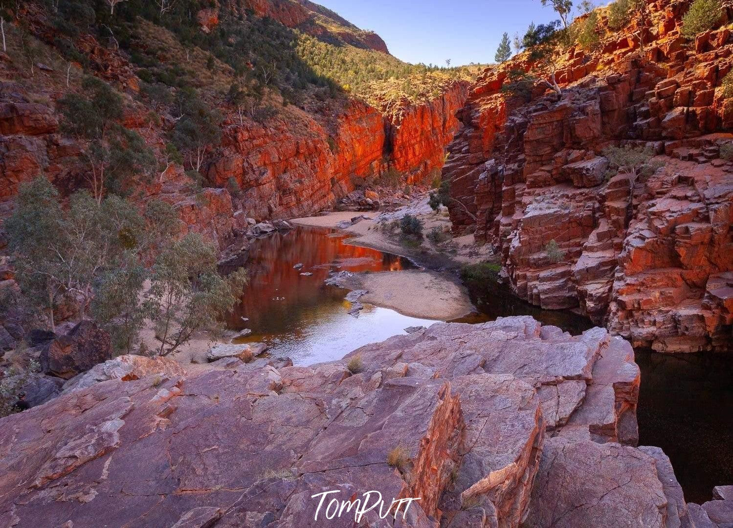 Large mountain stones below a high mountain wall, Ormiston Gorge - West Macdonnell Ranges, NT