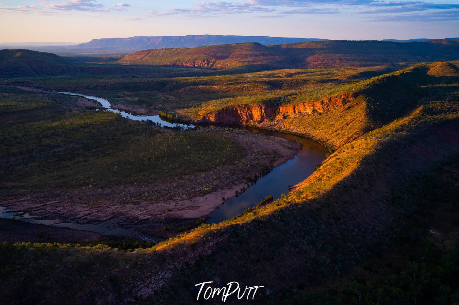 A drone view of long green mountain walls, with narrow flowing water below, PIDGEON HOLE, EL QUESTRO, The Kimberley, Western Australia