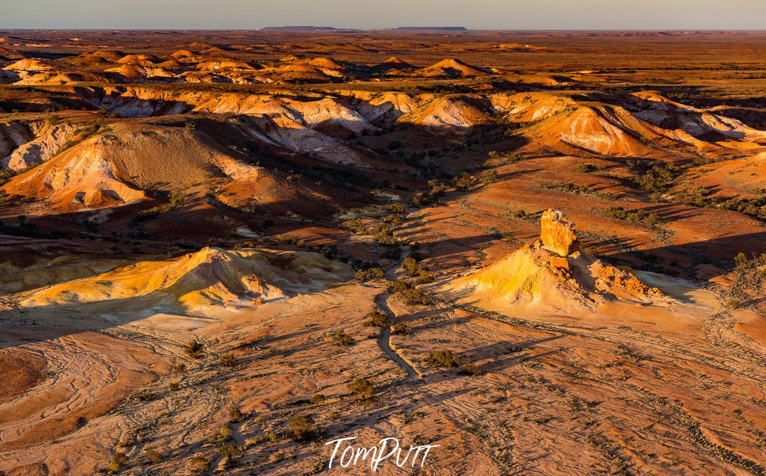 Aerial view of large golden mountains on desert land with sunlight fall, Painted Hills #14