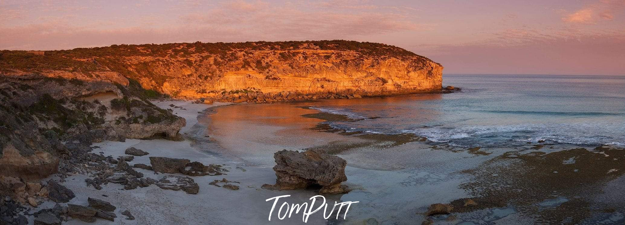 A beach with long shiny mountain wall behind, Pennington Dusk - Kangaroo Island SA