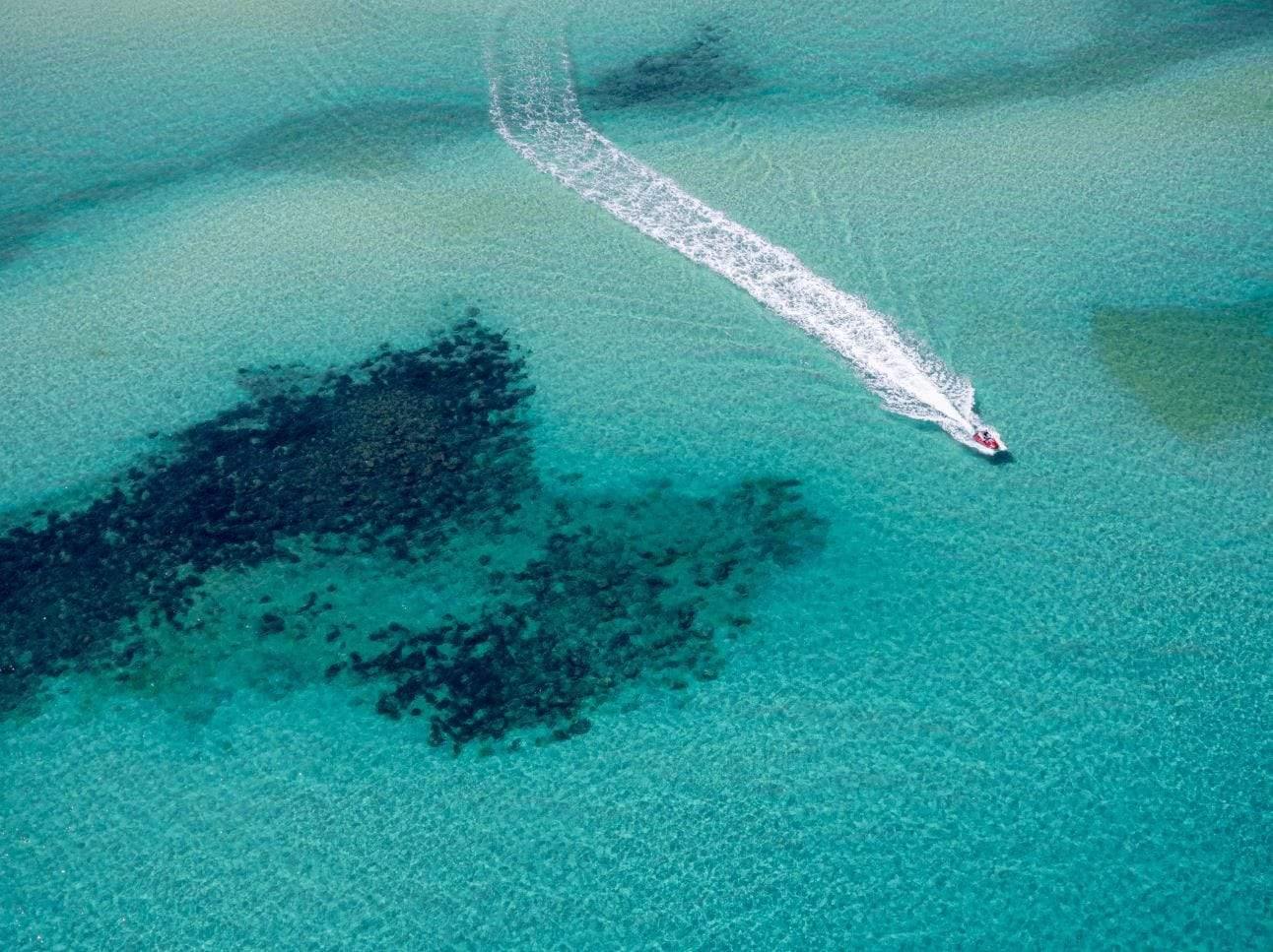 Aerial view of a sea with a boat passing over, Playtime - Mornington Peninsula VIC