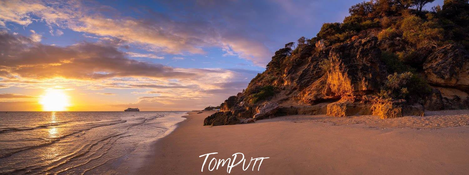 Large mountain wall on a seashore with the sunset behind, Point King Sunrise, Portsea - Mornington Peninsula VIC