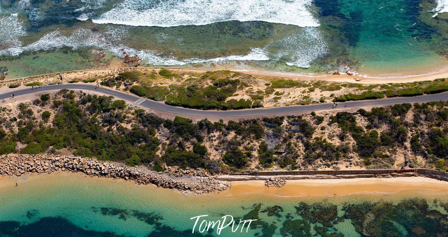 Aerial view of a sea corner with a lot of greenery and two road lines, Point Nepean National Park - Mornington Peninsula VIC