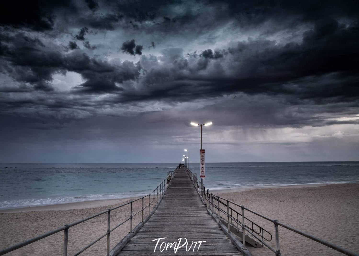 A long wooden track on a beach, and giant black thick clouds in the background, Port Noarlunga Jetty Print