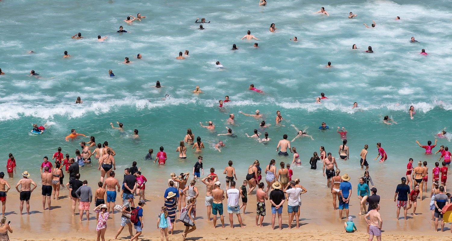 A crowdy beach with many people enjoying, Portsea Swimmers - Mornington Peninsula VIC