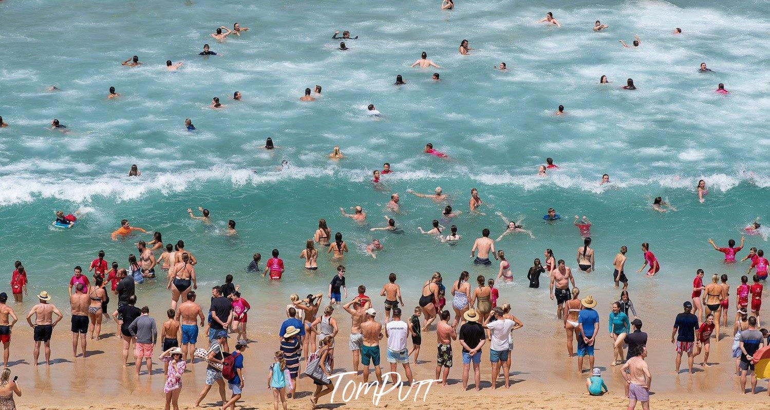 A crowdy beach with many people enjoying, Portsea Swimmers - Mornington Peninsula VIC