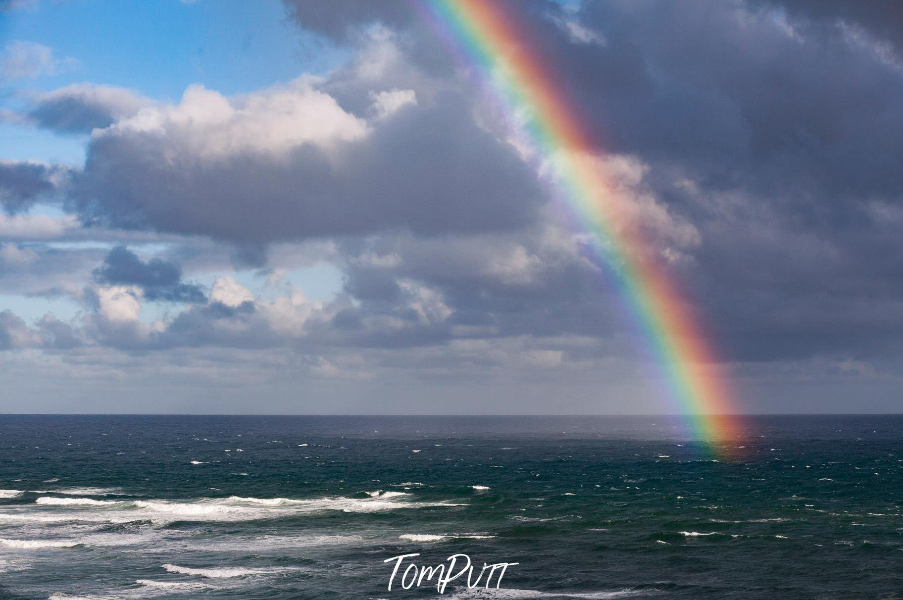 A beautiful rainbow over an ocean with clear white clouds, Pot of Gold - Mornington Peninsula VIC