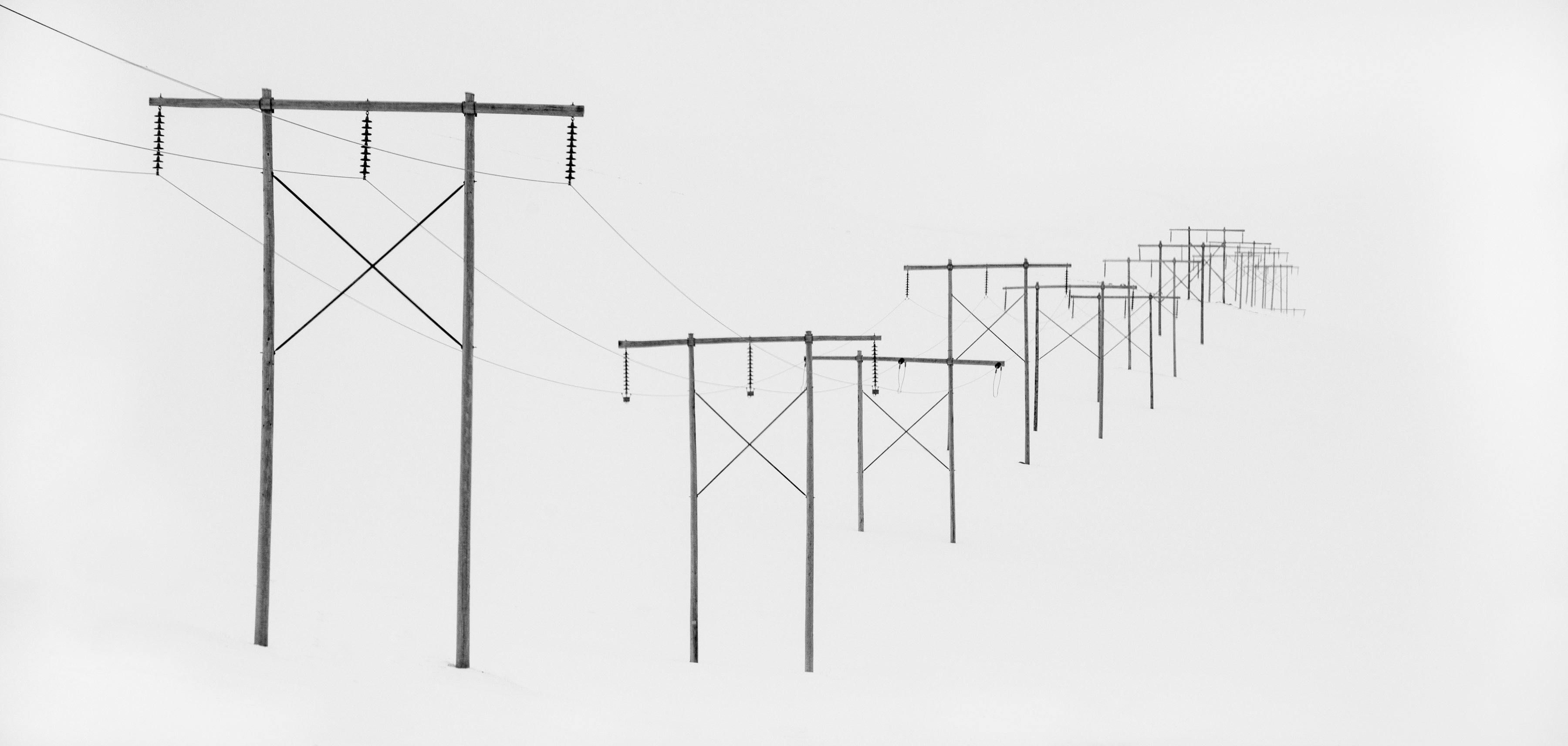 Electricity poles with wires on a snow-covered land, Power Poles in snow, Iceland
