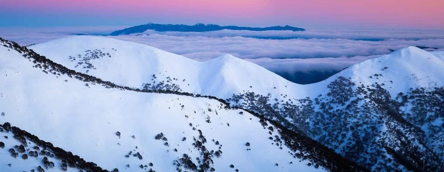 Long mountain walls covered with snow, Pre-Dawn Glow, Mount Hotham - Victorian High Country