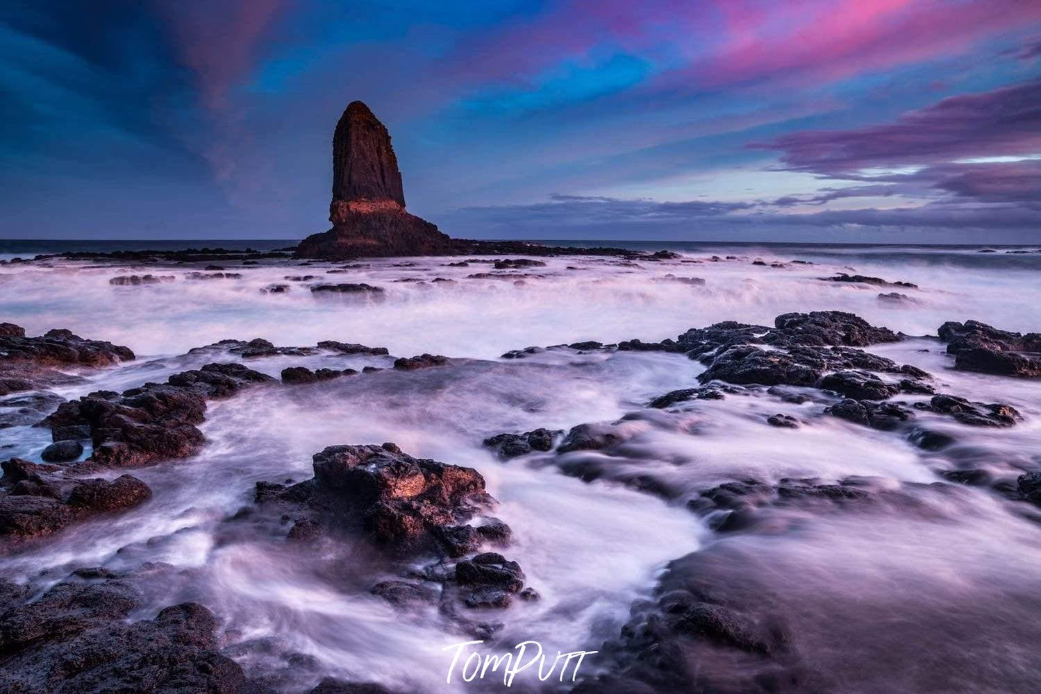 Rocky stones on a lake with a large standing mountain behind, Pulpit Rock, Cape Schanck - Mornington Peninsula VIC