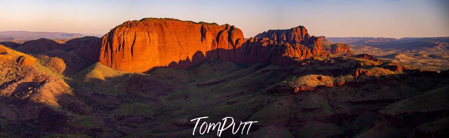 Long shot of a shiny standing mountain wall, Ragged Range #20, The Kimberley, Western Australia