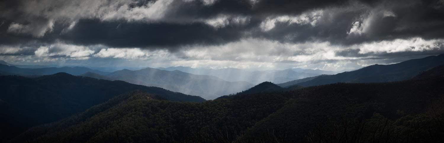 Dark mountain walls with heavy stormy clouds over them, Rain - Victorian High Country