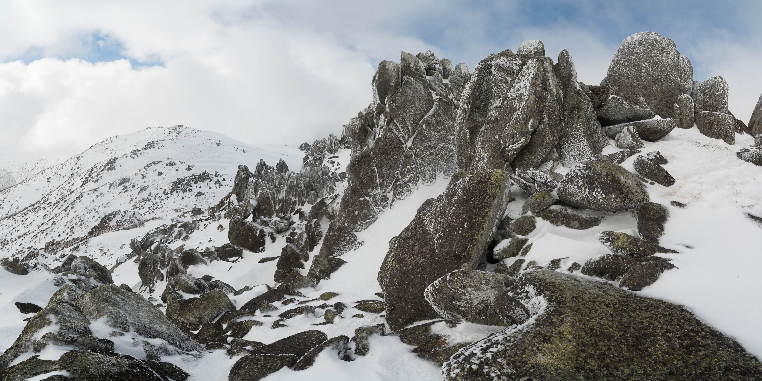 Rocky mountain walls peak, covered with snow, Ramshead Range in winter, Snowy Mountains, New South Wales