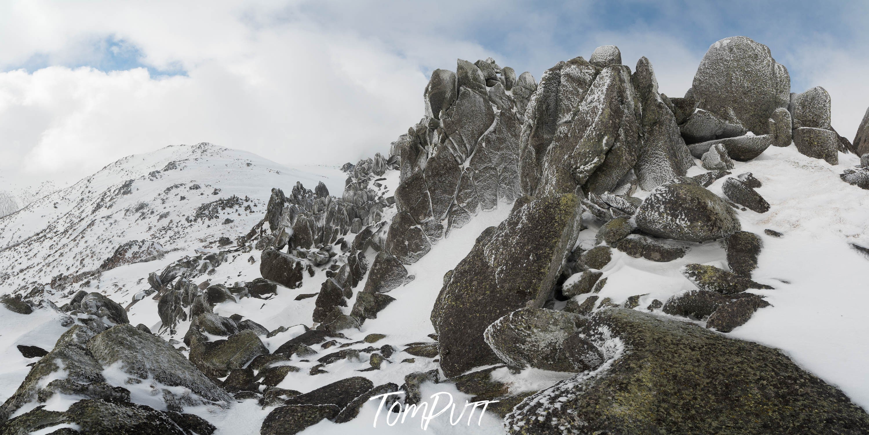 Rocky mountain walls peak, covered with snow, Ramshead Range in winter, Snowy Mountains, New South Wales