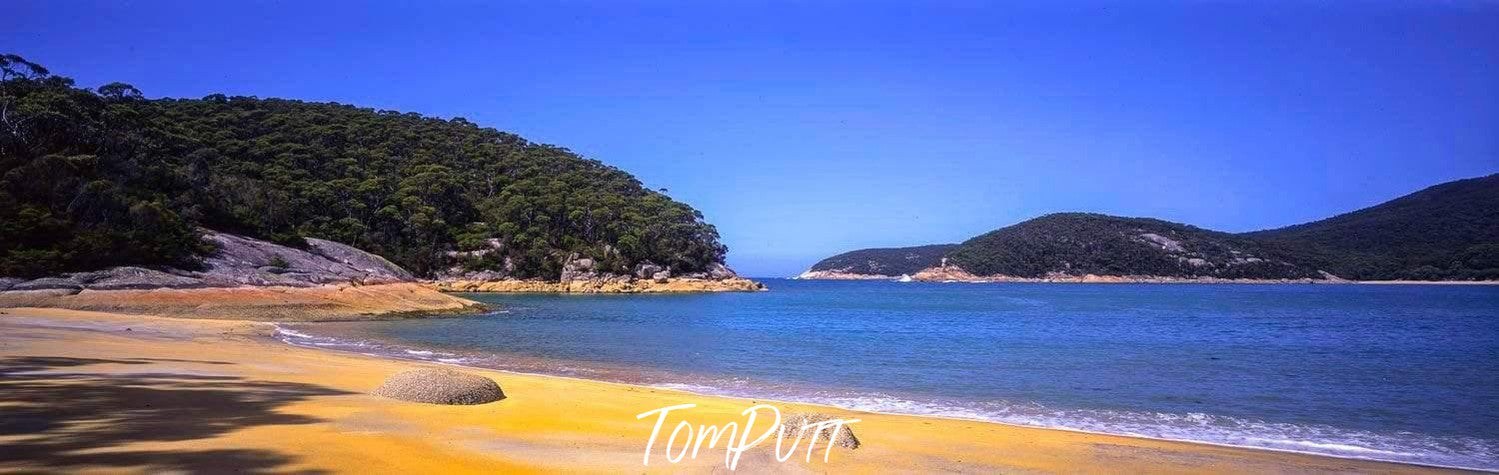 A beach with heavy green mountains behind, Refuge Cove - Wilson's Promontory VIC