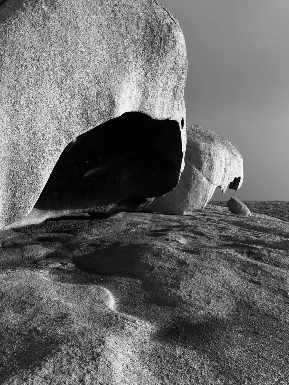 A black and white view of rocks with an opening tunnel face, Remarkable Rocks #2 - Kangaroo Island SA