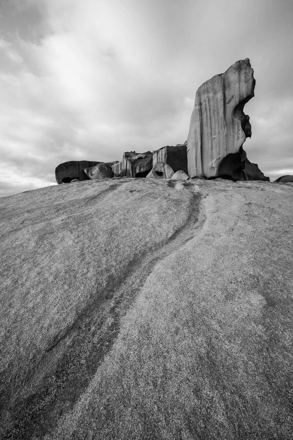 Black and white view of a land following a large standing stone, Remarkable Rocks #24 - Kangaroo Island SA