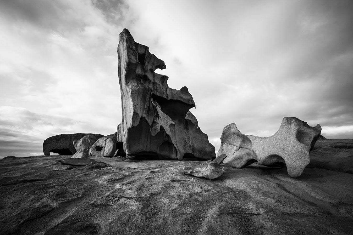 A black and white view of land with some stony mountains behind, Remarkable Rocks #25 - Kangaroo Island SA