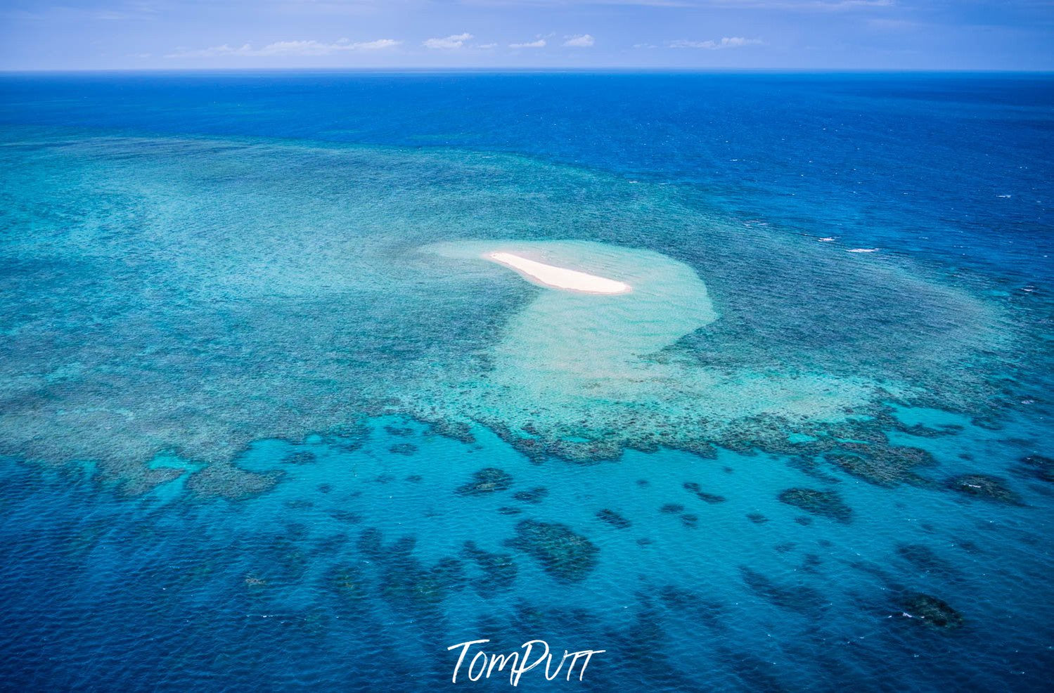 Aerial view of the large sea with greenery underwater, Remote Sandy Cay on the Great Barrier Reef, Far North Queensland