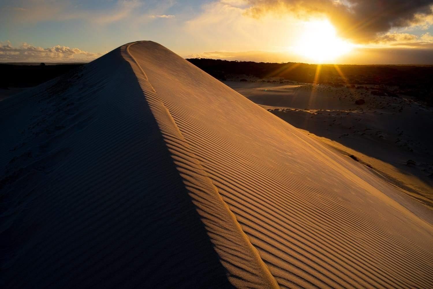 A large sand mound with the sunset behind, Sahara Glow - Kangaroo Island SA