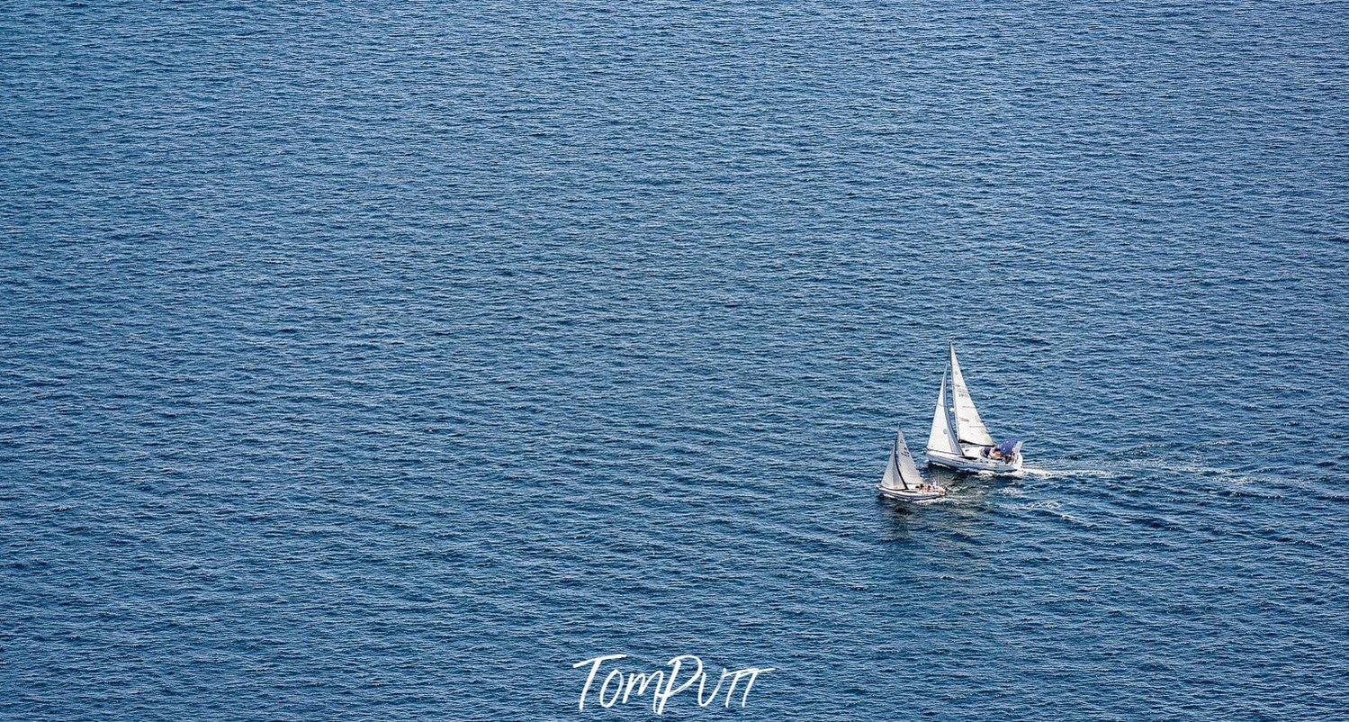 A long-shot view of an ocean with a couples of boats floating over, Sailing Away - Mornington Peninsula VIC