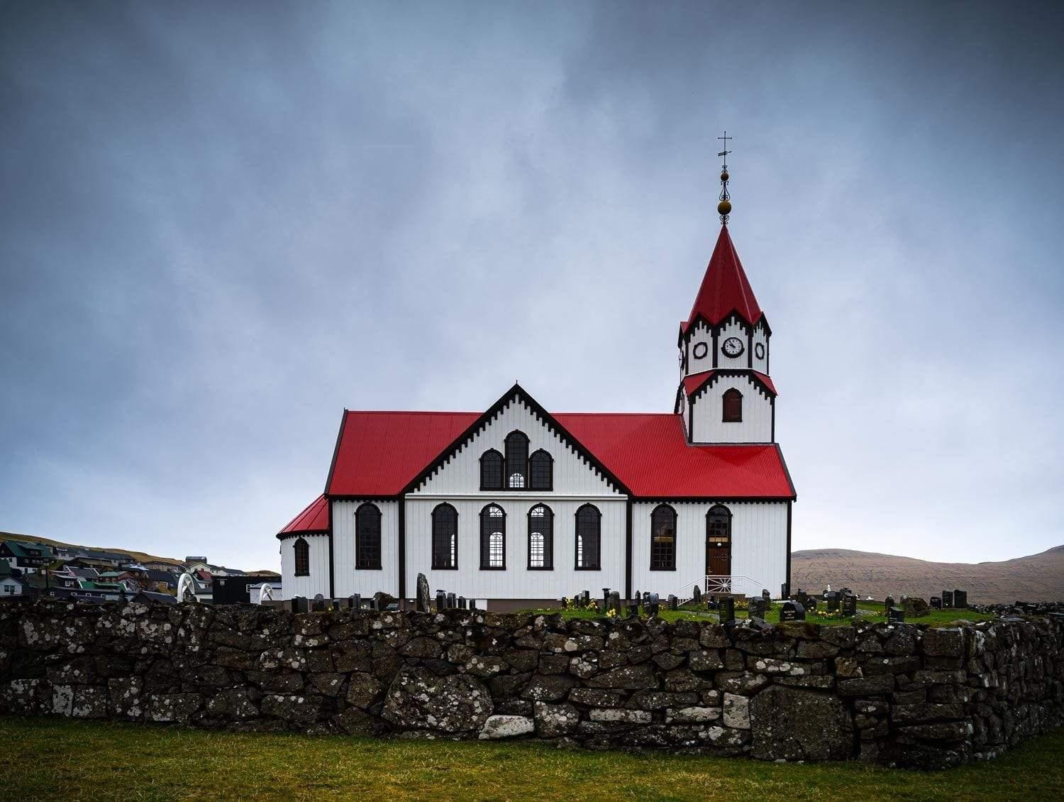 Beautiful church building on a green land, Sandavágur Church, Faroe Islands