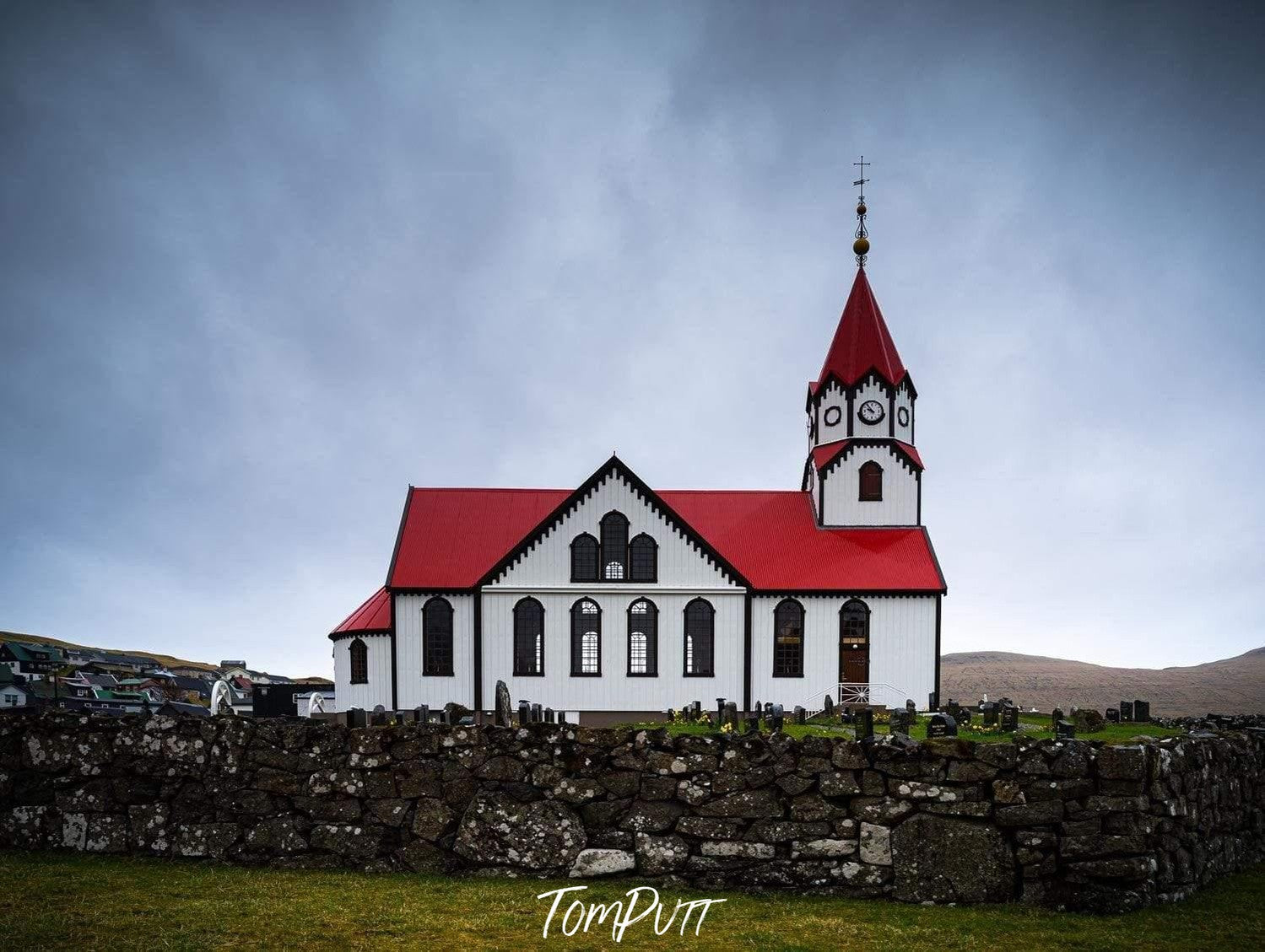 Beautiful church building on a green land, Sandavágur Church, Faroe Islands