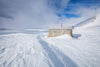 A hut in between of a large snow-covered land, Seaman's Hut - Snowy Mountains NSW