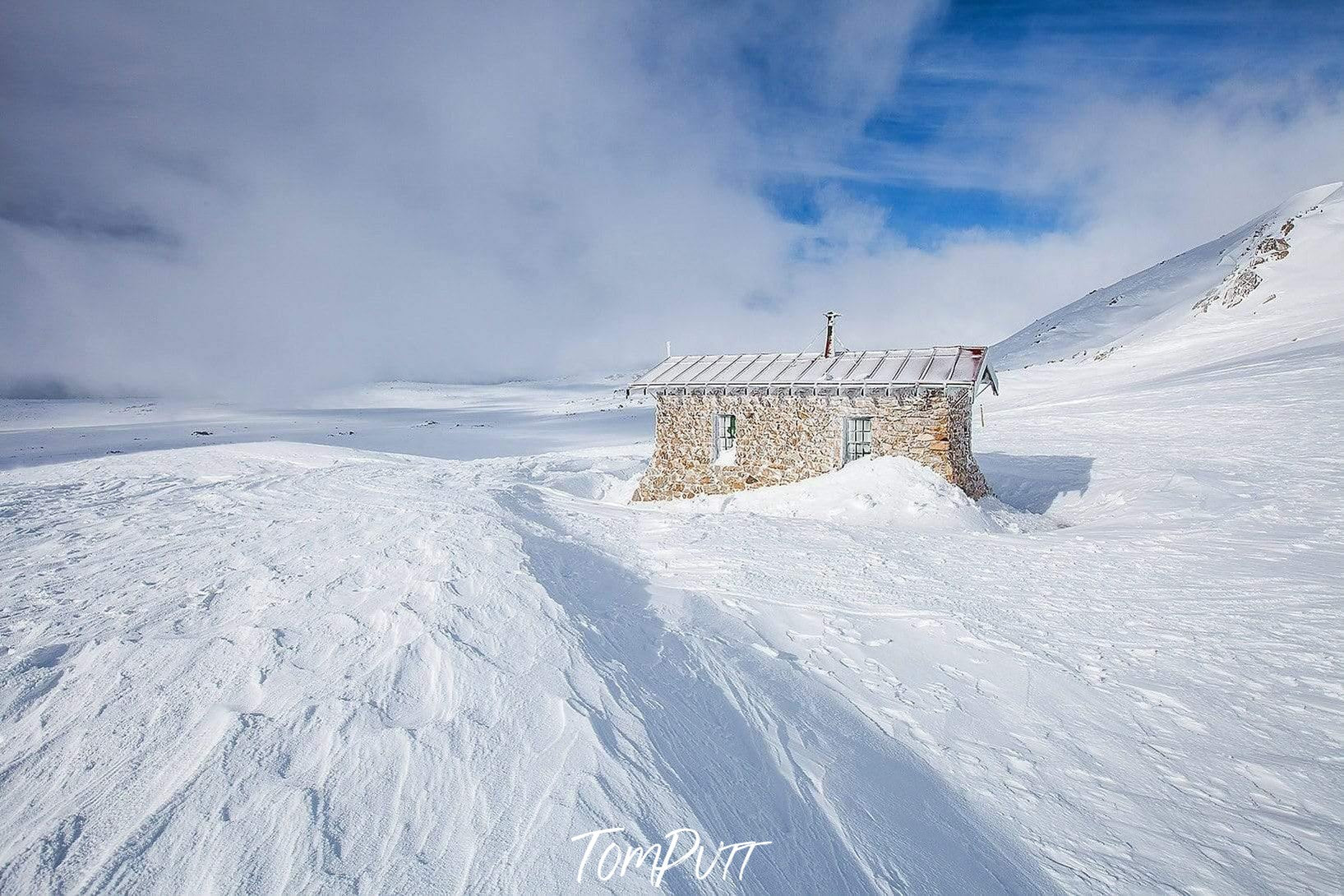 A hut in between of a large snow-covered land, Seaman's Hut - Snowy Mountains NSW