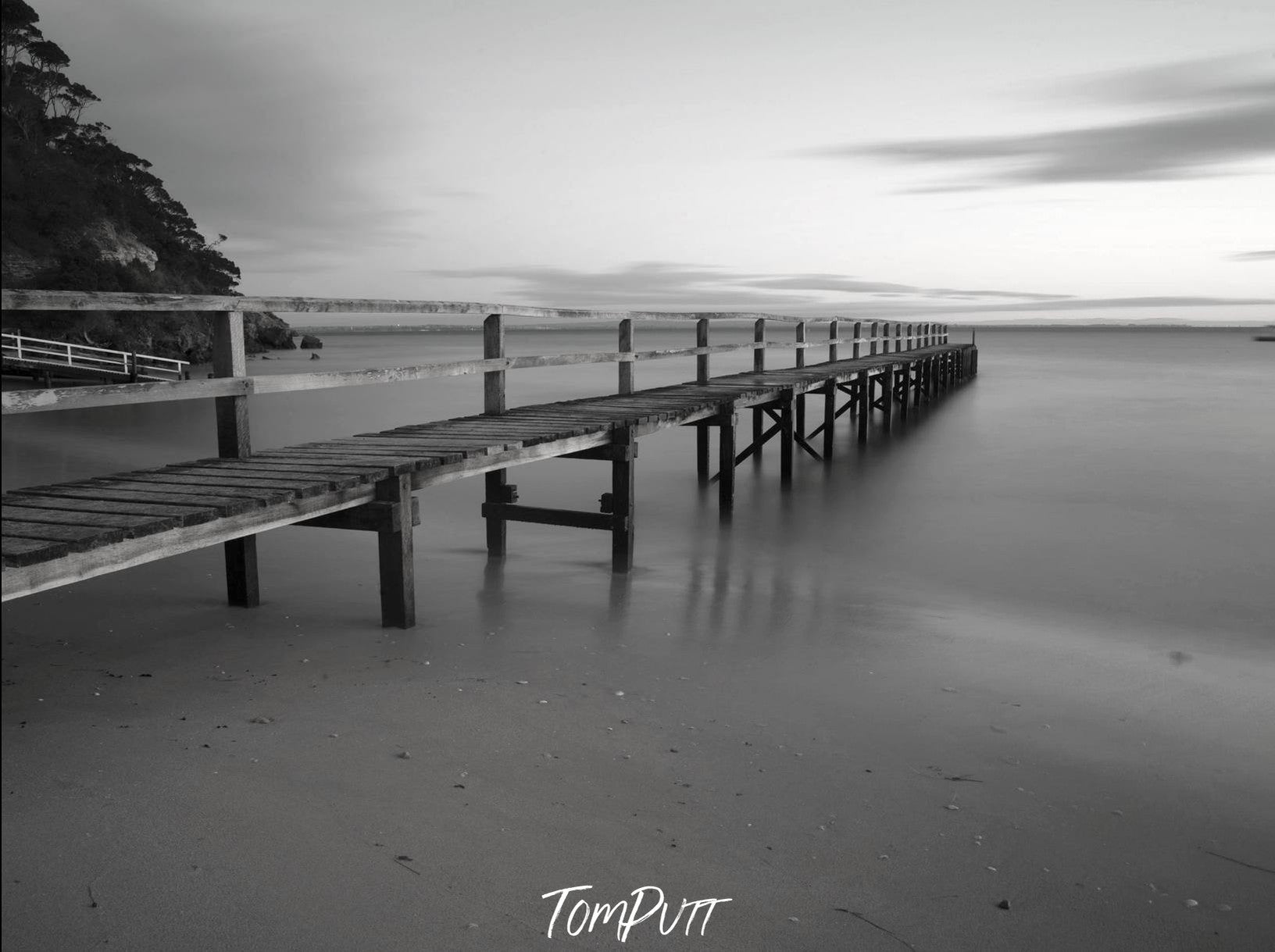 A black and white view of a wooden bridge on the seashore, Shelley Beach - Mornington Peninsula VIC