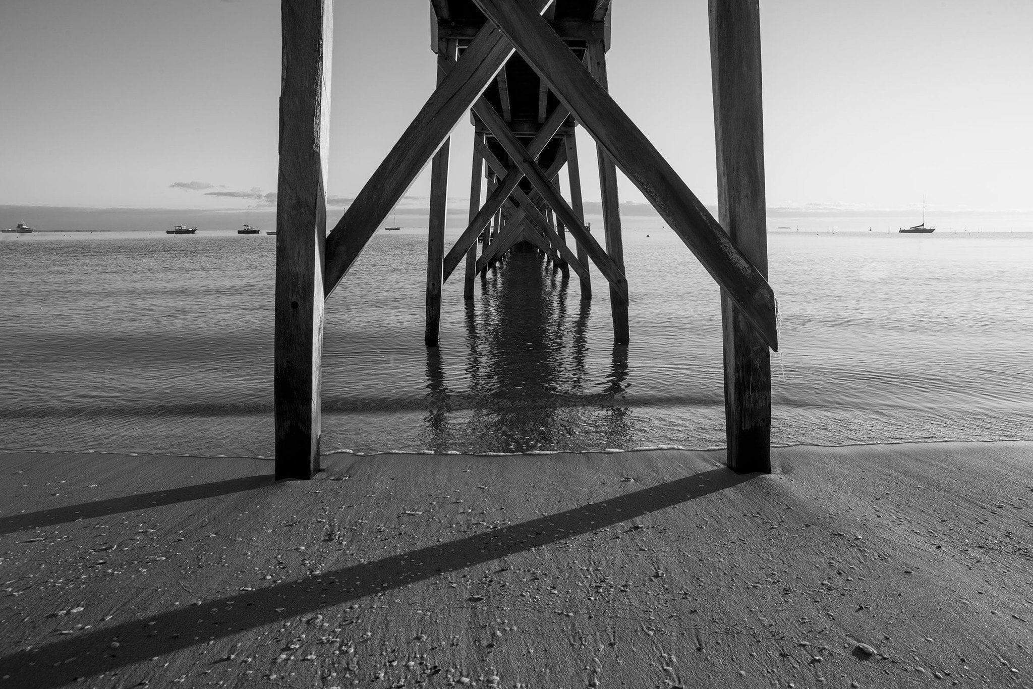 From the down capture of a wooden bridge on the beach, Sorrento Couta Boat Club pier, underneath