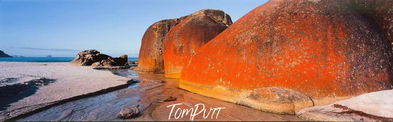 Giant burning orange mountains on a beach-like land, Squeaky Beach - Wilson's Promontory VIC