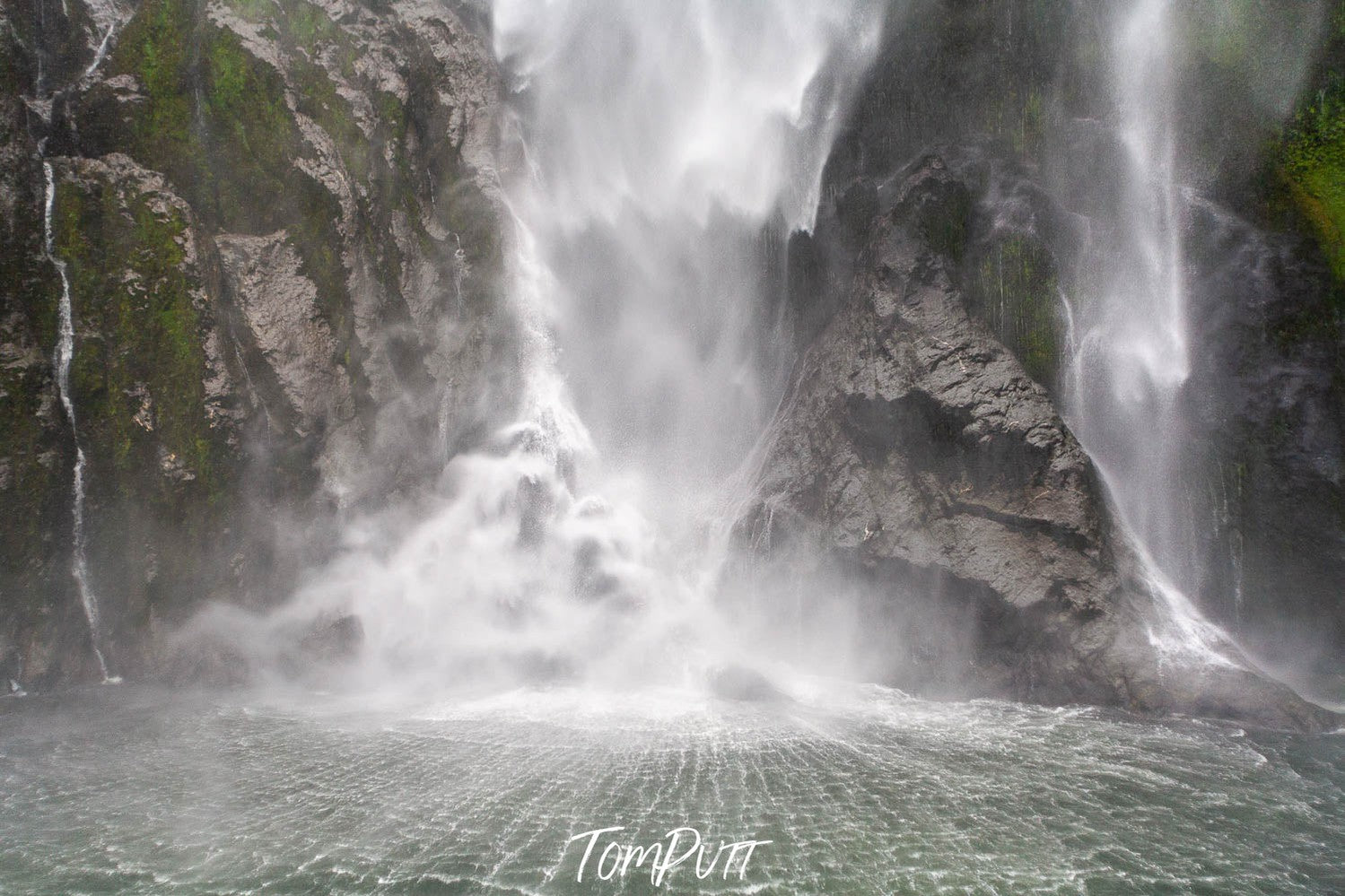 Stormy waterfall from a mountain wall, Stirling Falls, Milford Sound - New Zealand