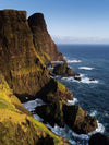 Large black standing mountain walls with the lake below, Suduroy Sea Cliffs, Faroe Islands